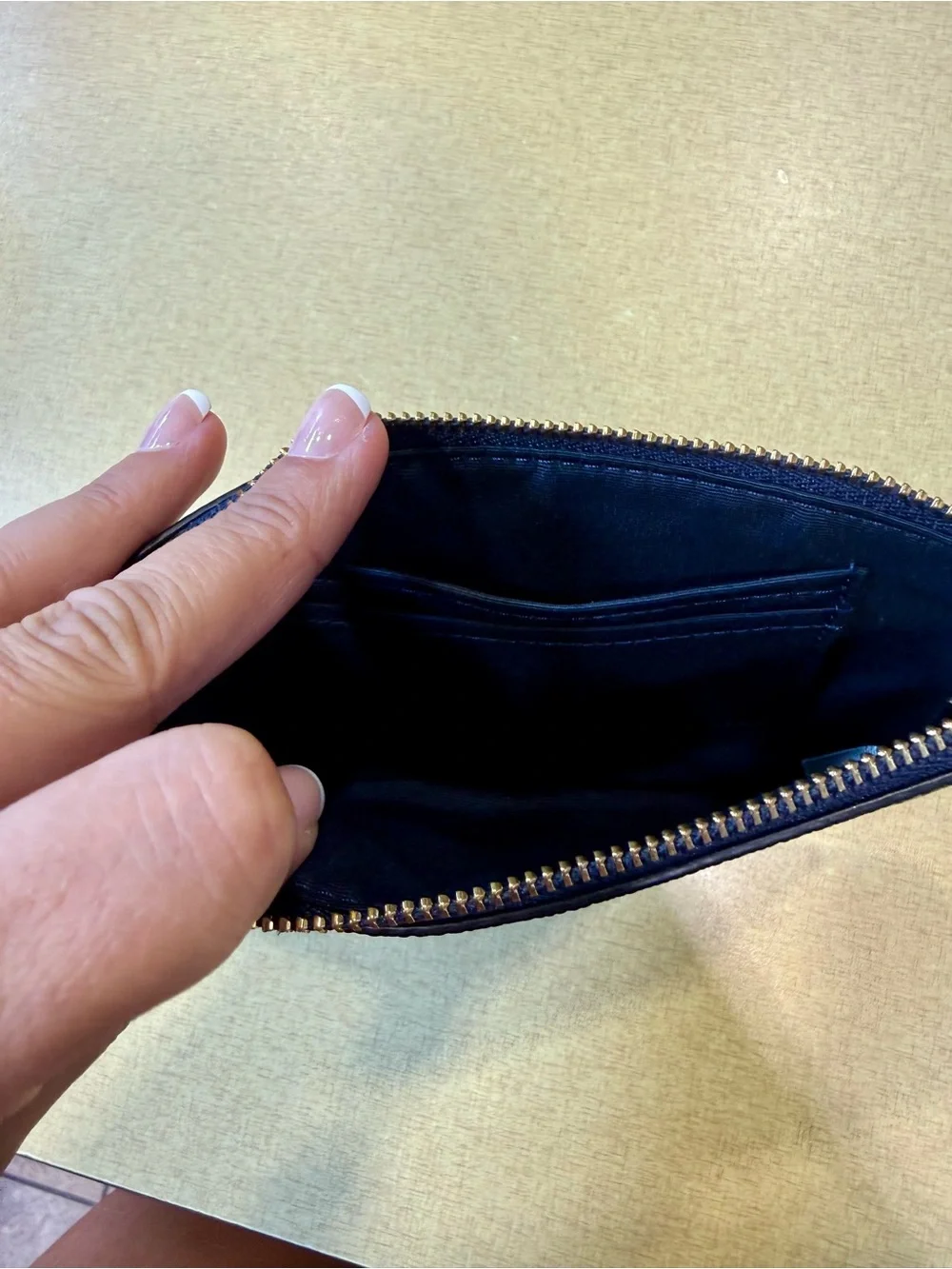 COACH Navy Pebbled Leather Wristlet with Gold Logo